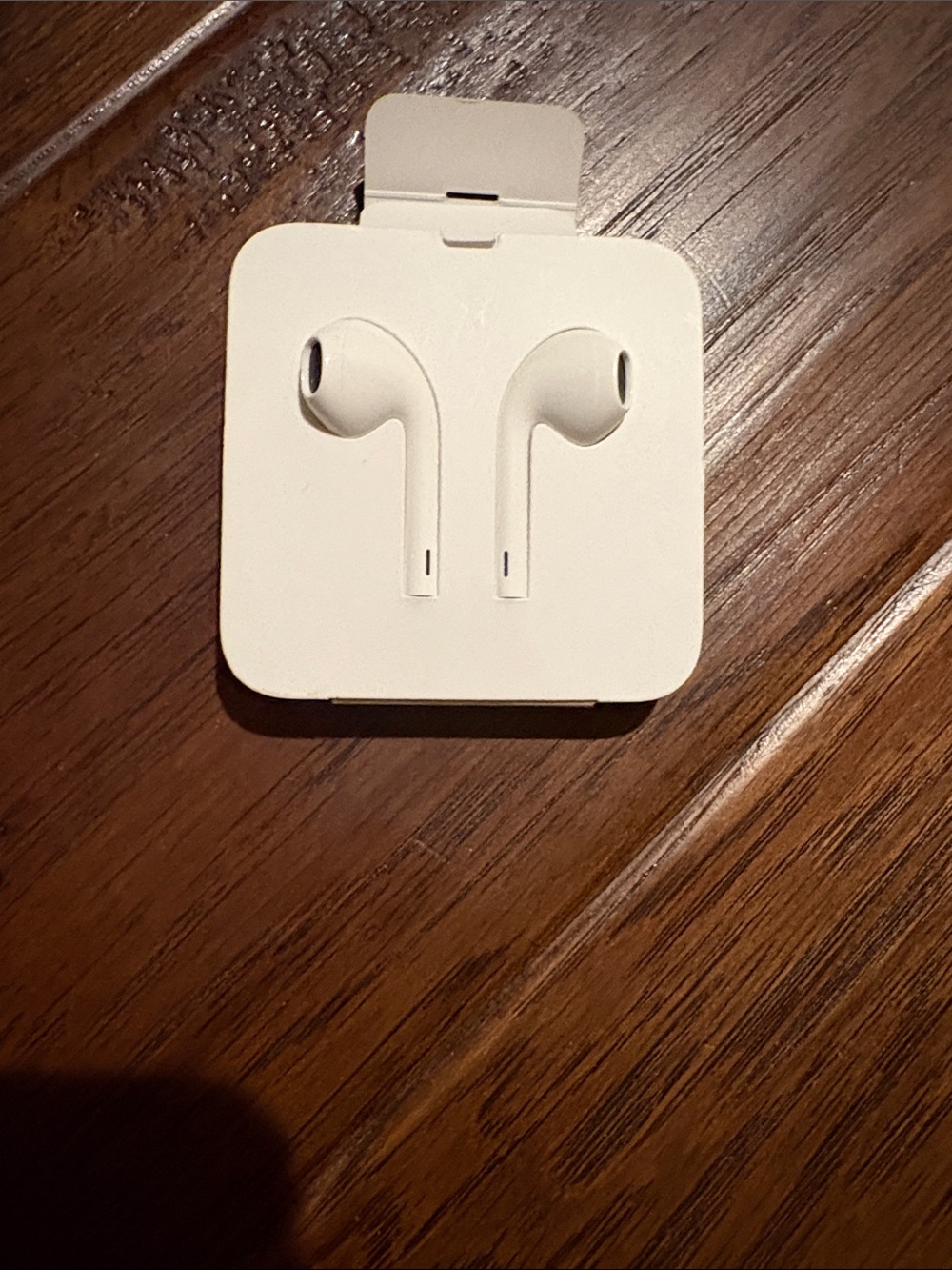 White Wired Earbuds in Retail Packaging